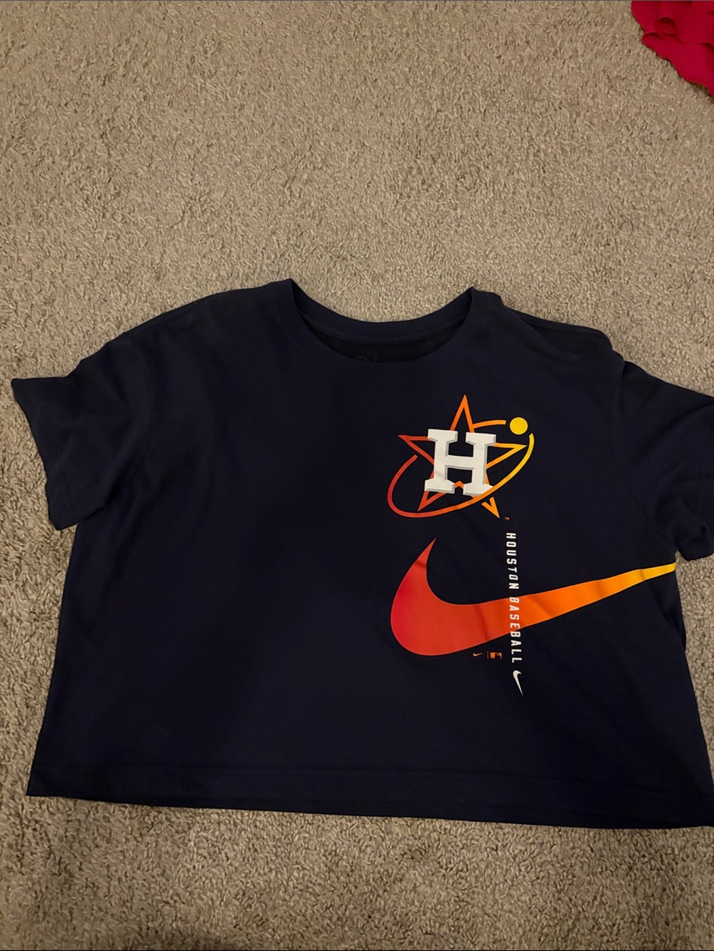 Nike woman’s cropped Navy Tee with Red-Orange Swoosh and Astros H Logo